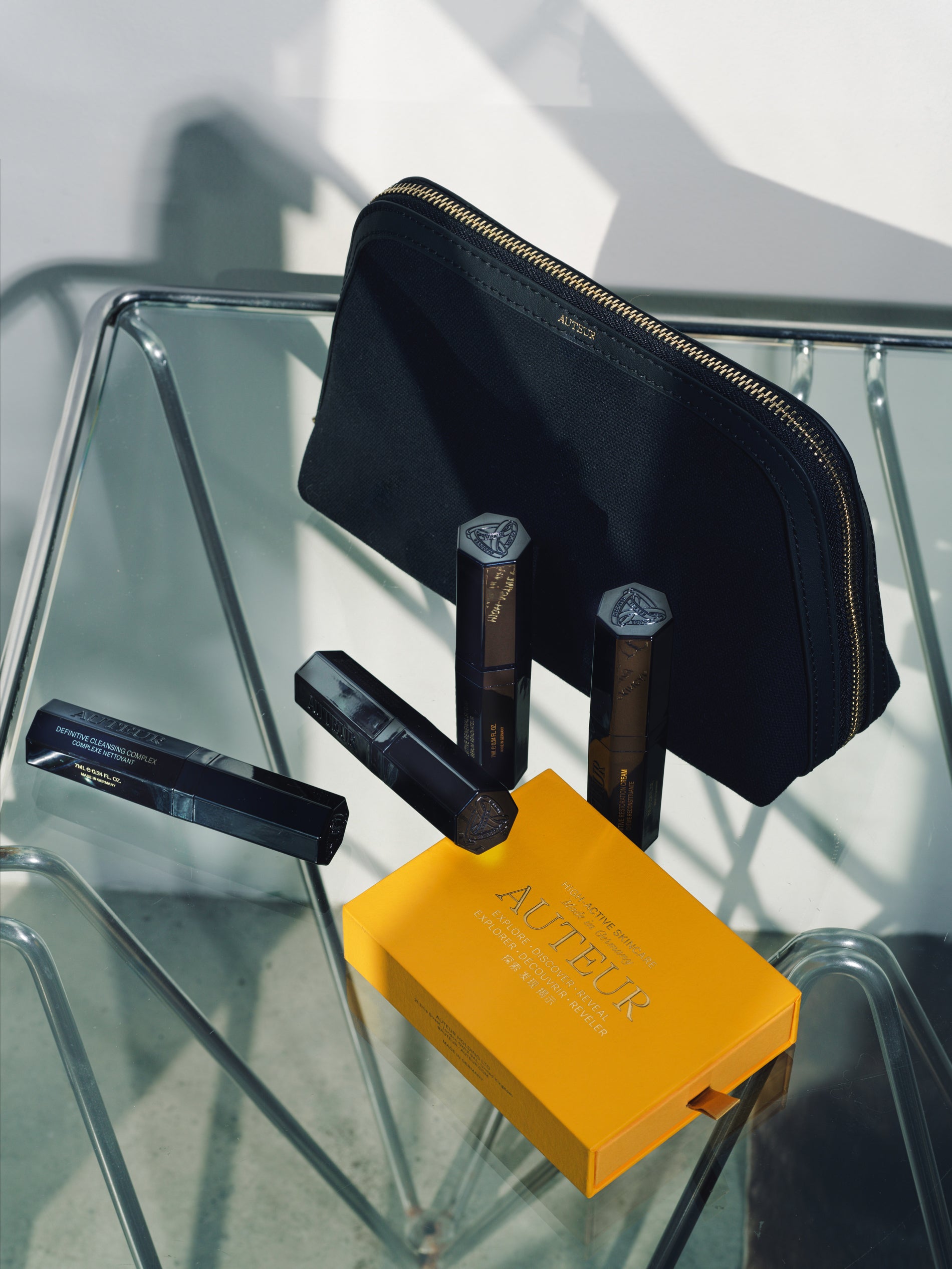 Black pouch with tools on a glass surface