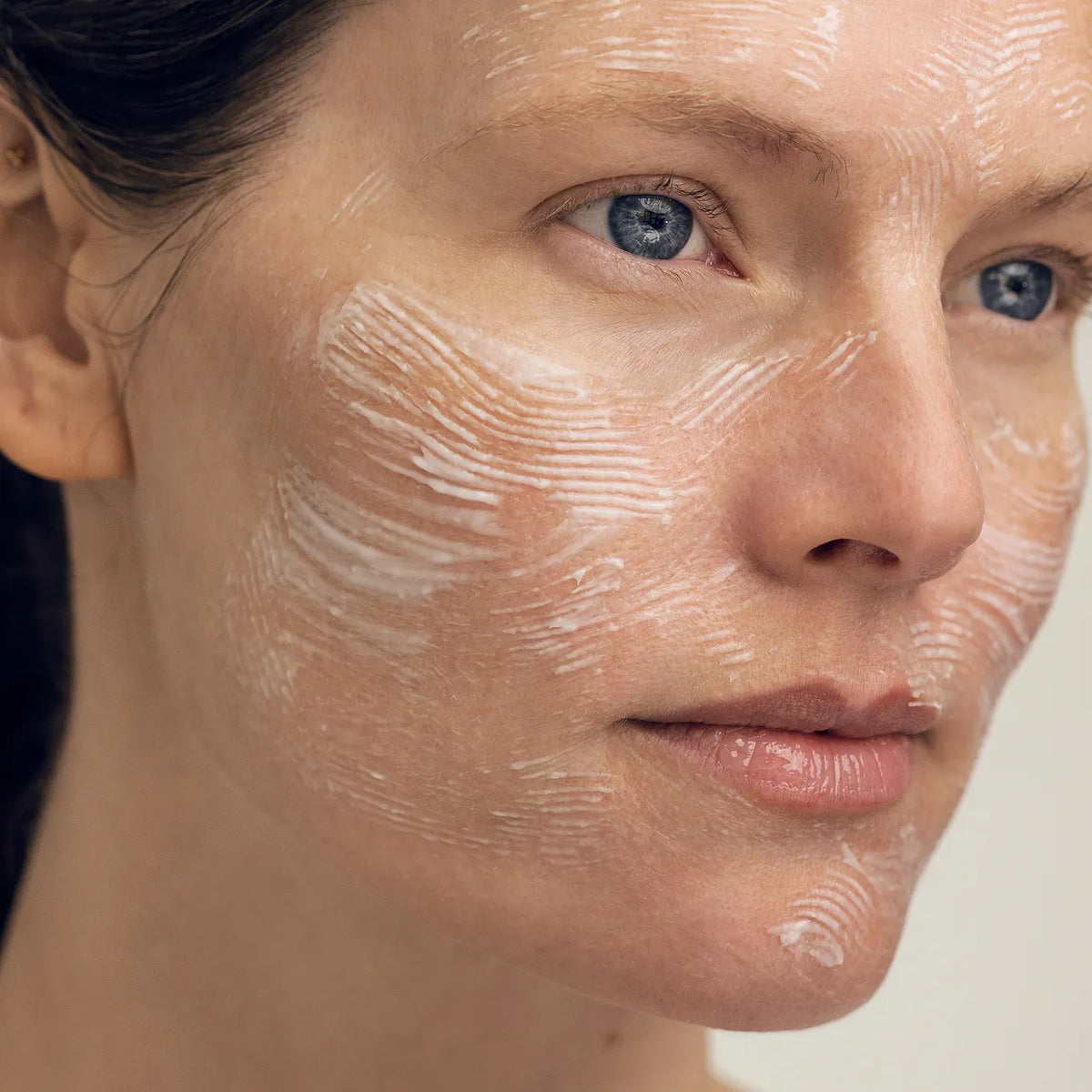 Model wearing AUTEUR Definitive Optimising Mask