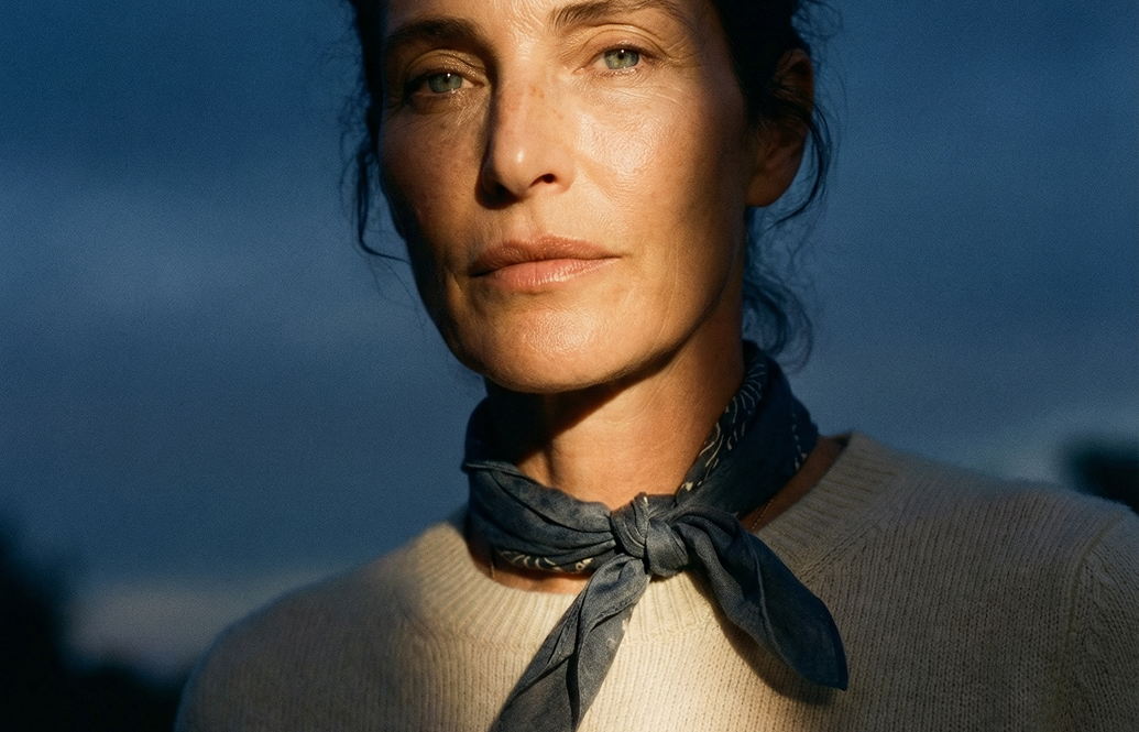 A 40 year old woman looking into camera