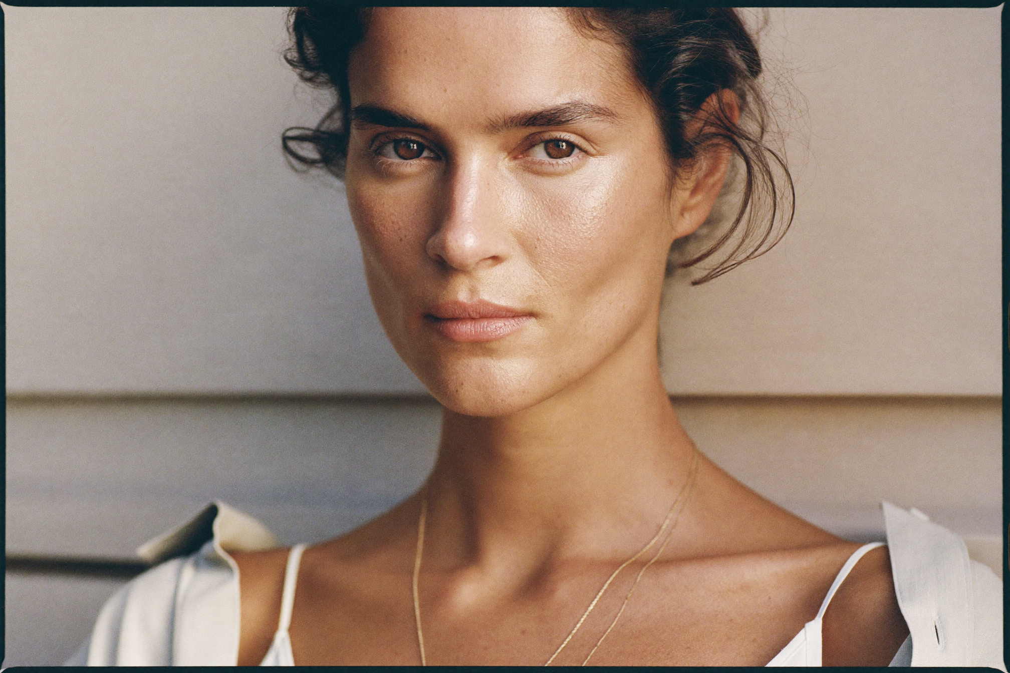 Editorial portrait of a woman with glowing skin, AUTEUR collagen production journal