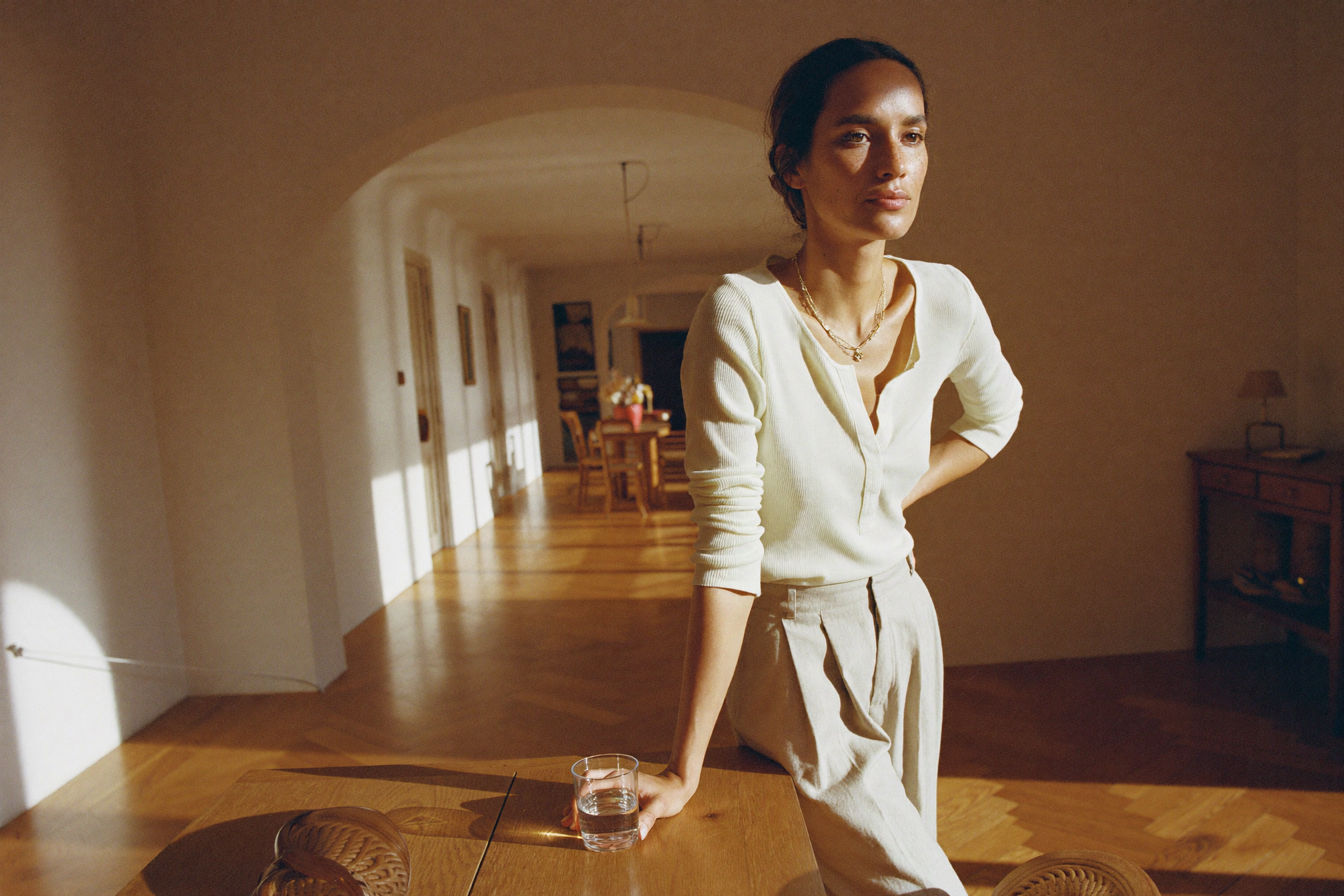 Editorial portrait of a woman in morning light, AUTEUR morning skincare routine journal